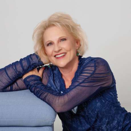 Julie Ferman, professional matchmaker, smiling warmly